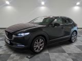 the mazda cx - hr is parked on a checkered floor
