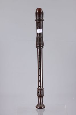 the flute is made of wood and has a wooden handle