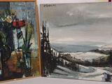 two paintings that are on a table next to each other