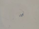 an image of a white plate with a blue design on it