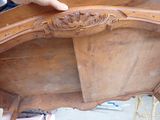 a person that is working on a piece of furniture