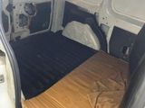a bed in the back of a van with a mattress on it
