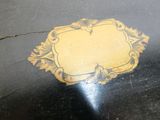 a black table with a yellow design on it