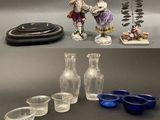 many different types of glass items displayed on the table