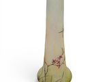 tall glass vase with a floral design on a white background