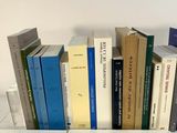 a lot of books that are sitting on a table