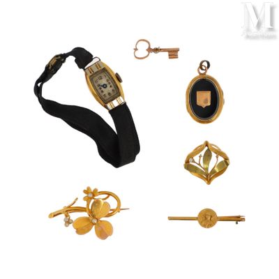 an image of a collection of jewelry including a watch, key, and other items