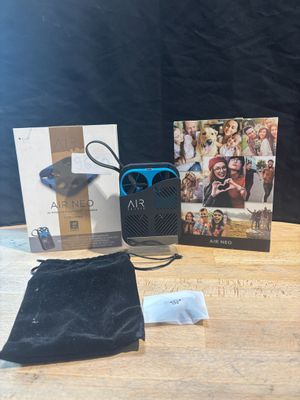 an image of a table with a bag and a cell phone on it