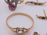 many different types of rings on a white surface