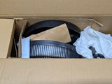 cardboard box containing a variety of kitchen items including a frying pan, frying pan, and a frying pan