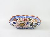 a blue and white bowl with flowers on it