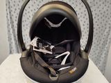 a baby car seat that is on a table
