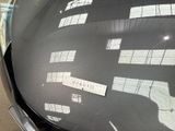 a sticker on the hood of a car that has a message on it
