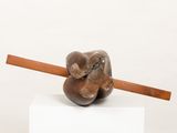 sculpture of a elephant holding a pencil on top of a white pedestal