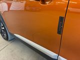 a close up of a car door handle with a sticker on it