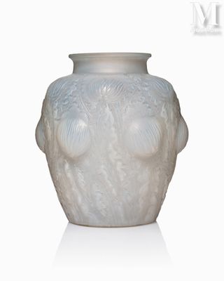 a white vase with a face on it on a white surface