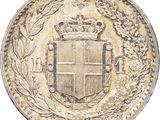 a close up of a coin with a crown on it