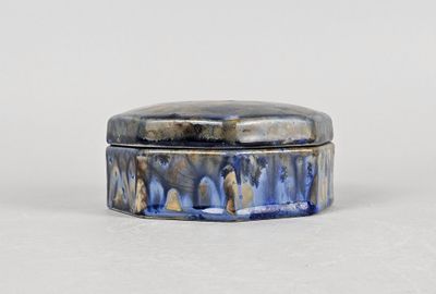 an image of a small blue box sitting on top of a white surface