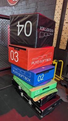 many boxes stacked on top of each other in a gym