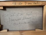 a picture of a wooden frame with writing on it