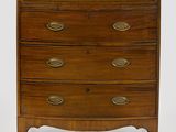 an image of a wooden chest of drawers with brass handles