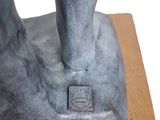 a statue of a person standing on top of a table