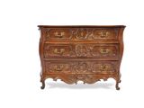 an antique chest of drawers with ornate carvings on the drawers