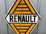an orange and black sign with the word renault on it