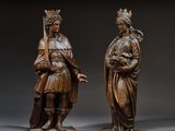 pair of carved wood figures of a woman and a man