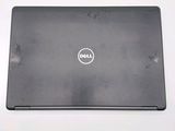dell laptop computer sitting on top of a table with a white background