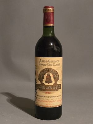 a bottle of wine that is sitting on a table