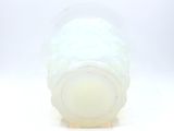 a plastic cup with a lid on a white surface