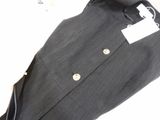 a close up of a suit on a white surface