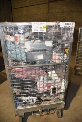 a metal cart with many items in it in a warehouse