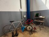 two bikes that are parked in a garage