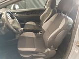 the interior of a car with two seats and a steering wheel