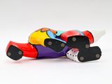a toy motorcycle that is sitting on a white surface
