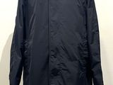 the coat is black and has a white collar