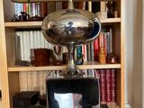 a lamp that is sitting on top of a glass table