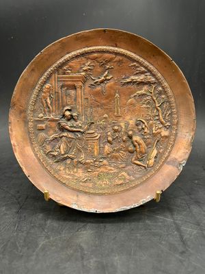 an old copper plate with an image of a man and a woman in a garden