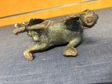 a bronze statue of a horse on a table