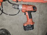 a cordless drill and a cordless hammer on the floor