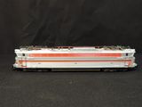 a toy train on a black surface with a black background