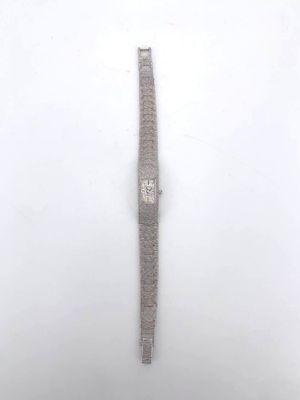 wrist watch in the snow on a snowy day with a white background