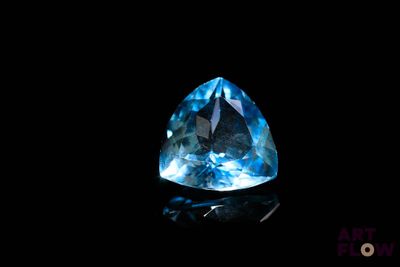 a blue topazte gems on a black background