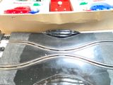 a train set in a box on the floor