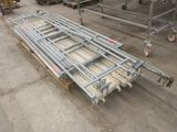 a lot of scaffolding on the ground in a warehouse
