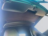 the interior of a car with the sun shining through the window
