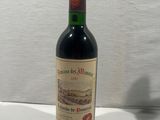 a bottle of wine that is sitting on a table