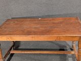 a small wooden table with a drawer on top of it